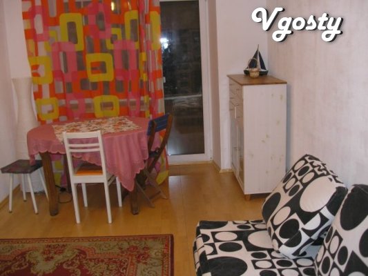 The bedroom has a double bed, single bed - Apartments for daily rent from owners - Vgosty